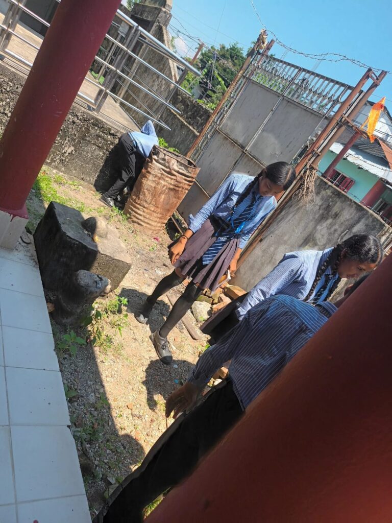 Students Cleaning the Ground